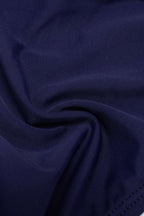 Bikini triangle bleu marine à bordure dentelle