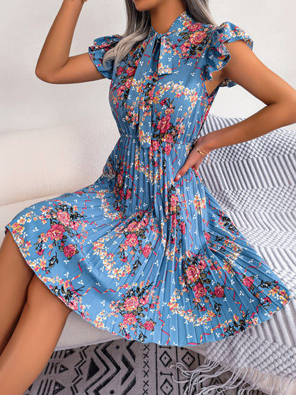 Robe bohème plissée à imprimé floral et col lavallière